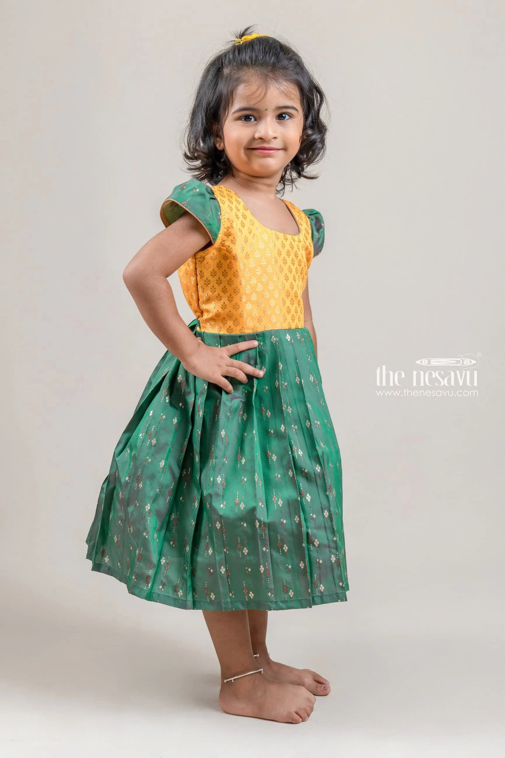 Cute Brocade Designer Yellow Yoke And Green Pleated Semi-Silk Frock For Girls